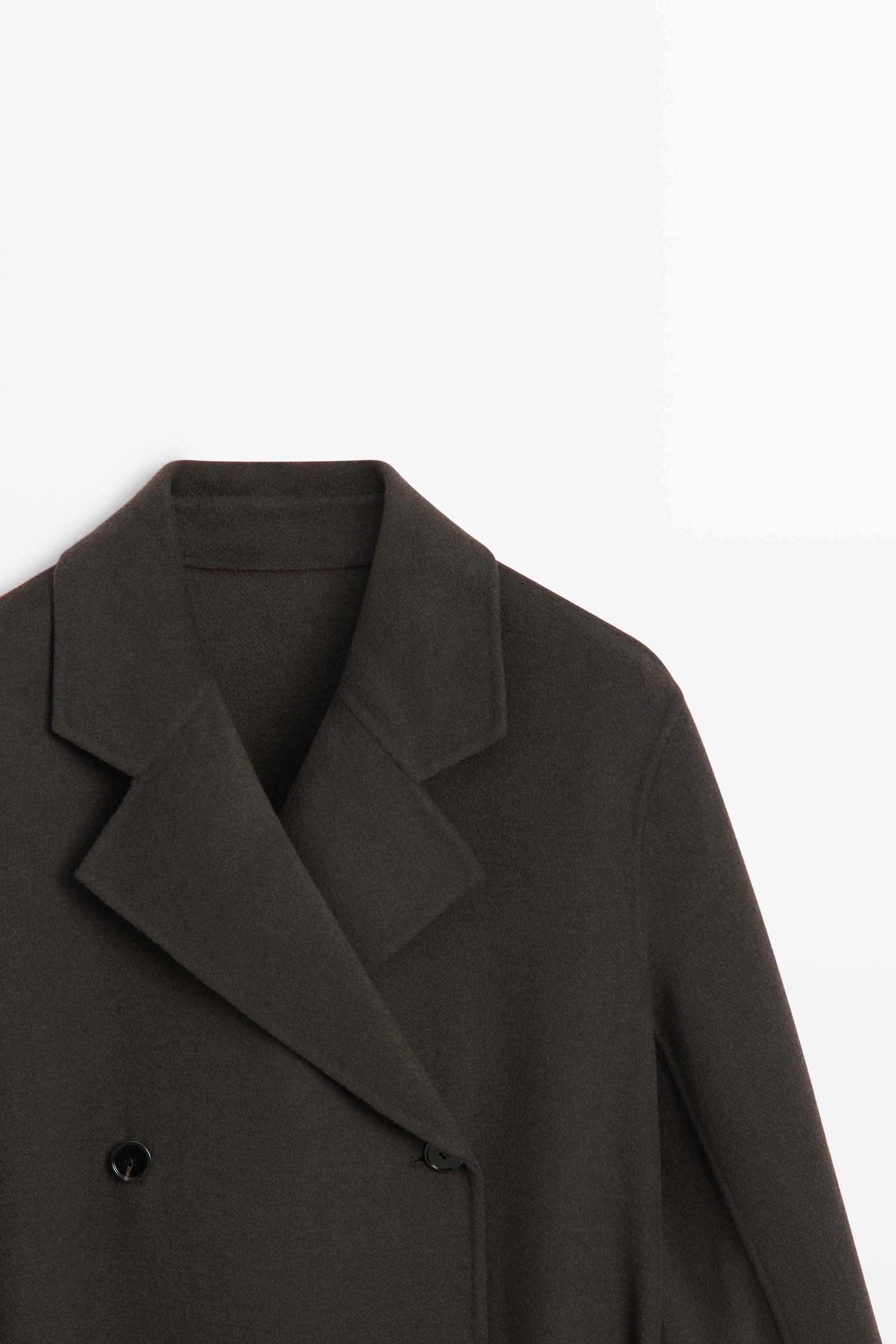 Manteau long croisé détail ceinture