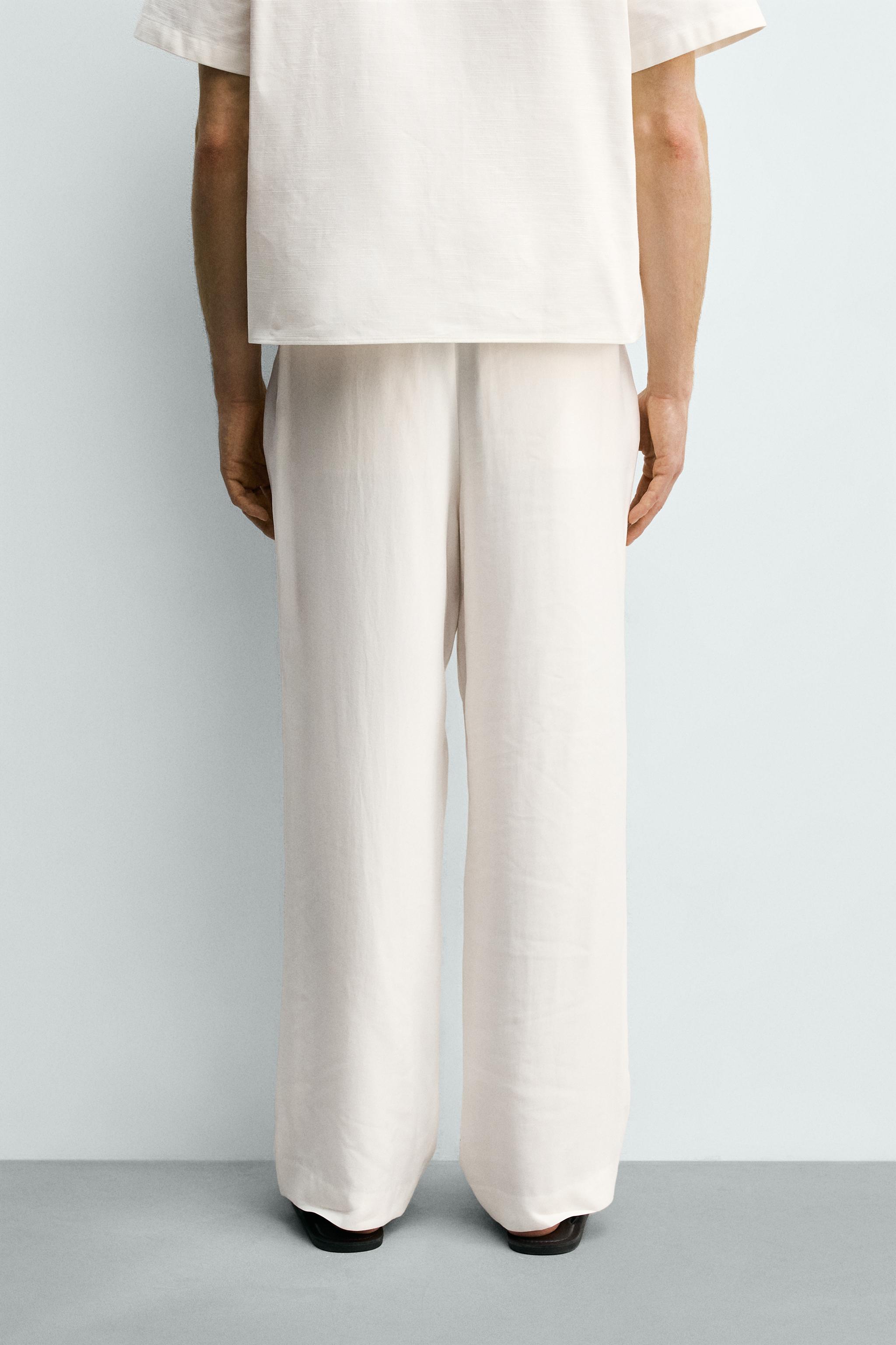 RELAXED FIT PLEATED PANTS