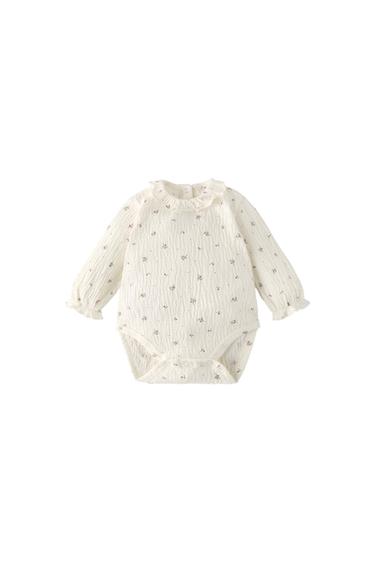 TEXTURED BODYSUIT WITH BRANCHES