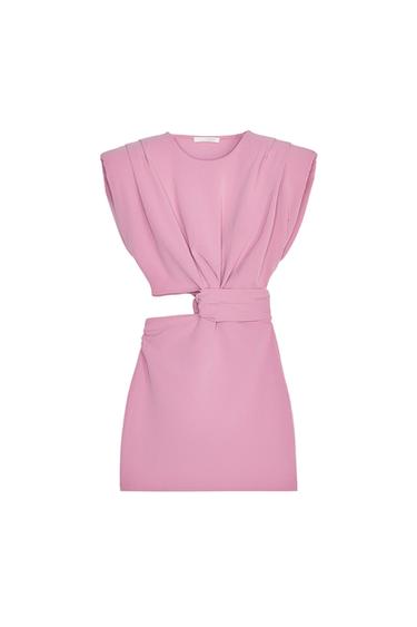 Front view of pink dress with asymmetric cut and pleats at the waist