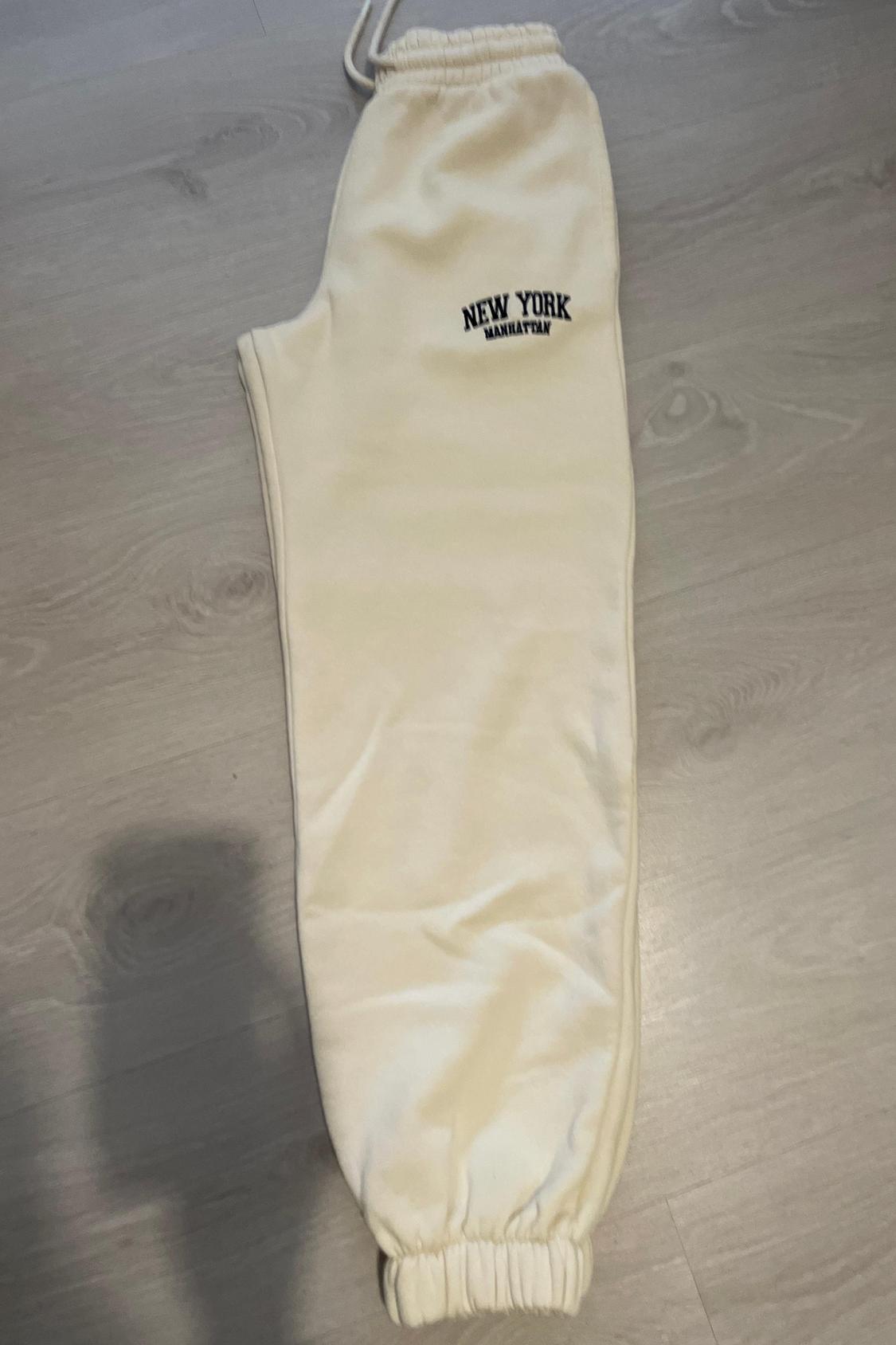 JOGGING TROUSERS WITH EMBROIDERED SLOGAN