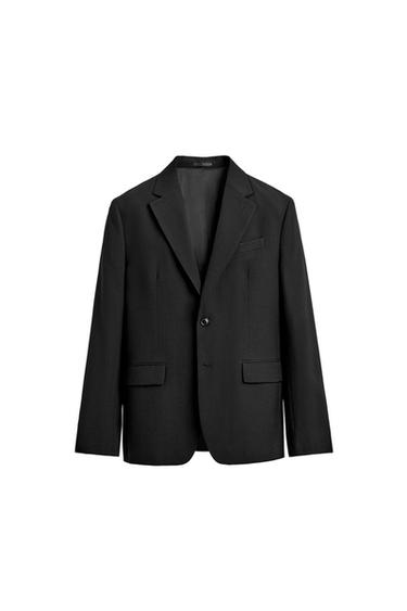 Front view of black blazer with notch lapels, button fastening, jetted chest pocket and flap pockets at the hip.
