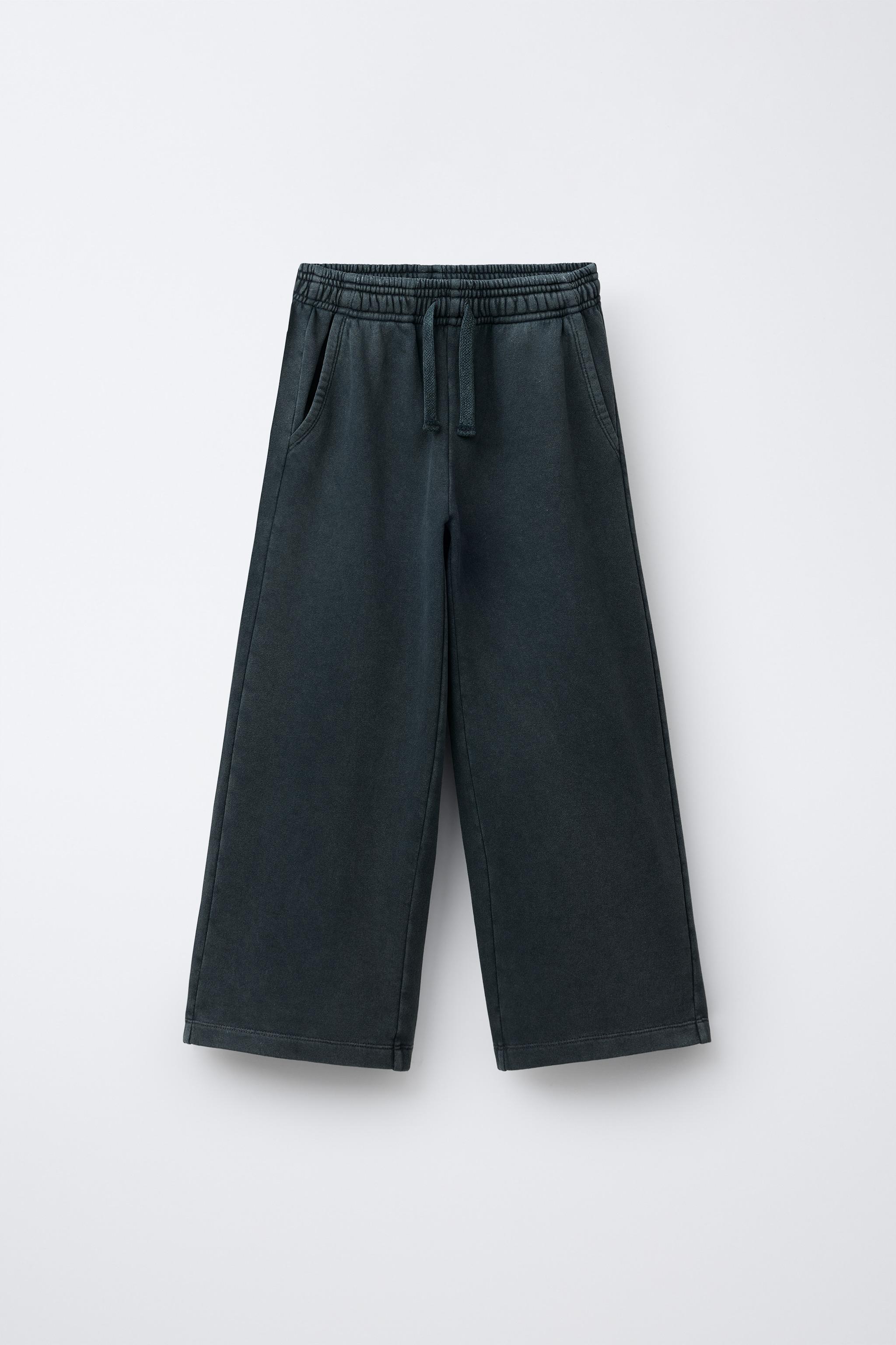 WASHED EFFECT WIDE LEG PANTS WITH STARS AND STUDS