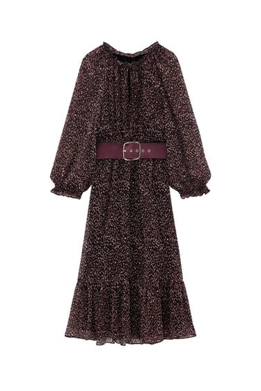 Dark midi dress with a spot print. Long puff sleeves, gathered neckline, wide burgundy belt with a buckle, and a frilled hem.
