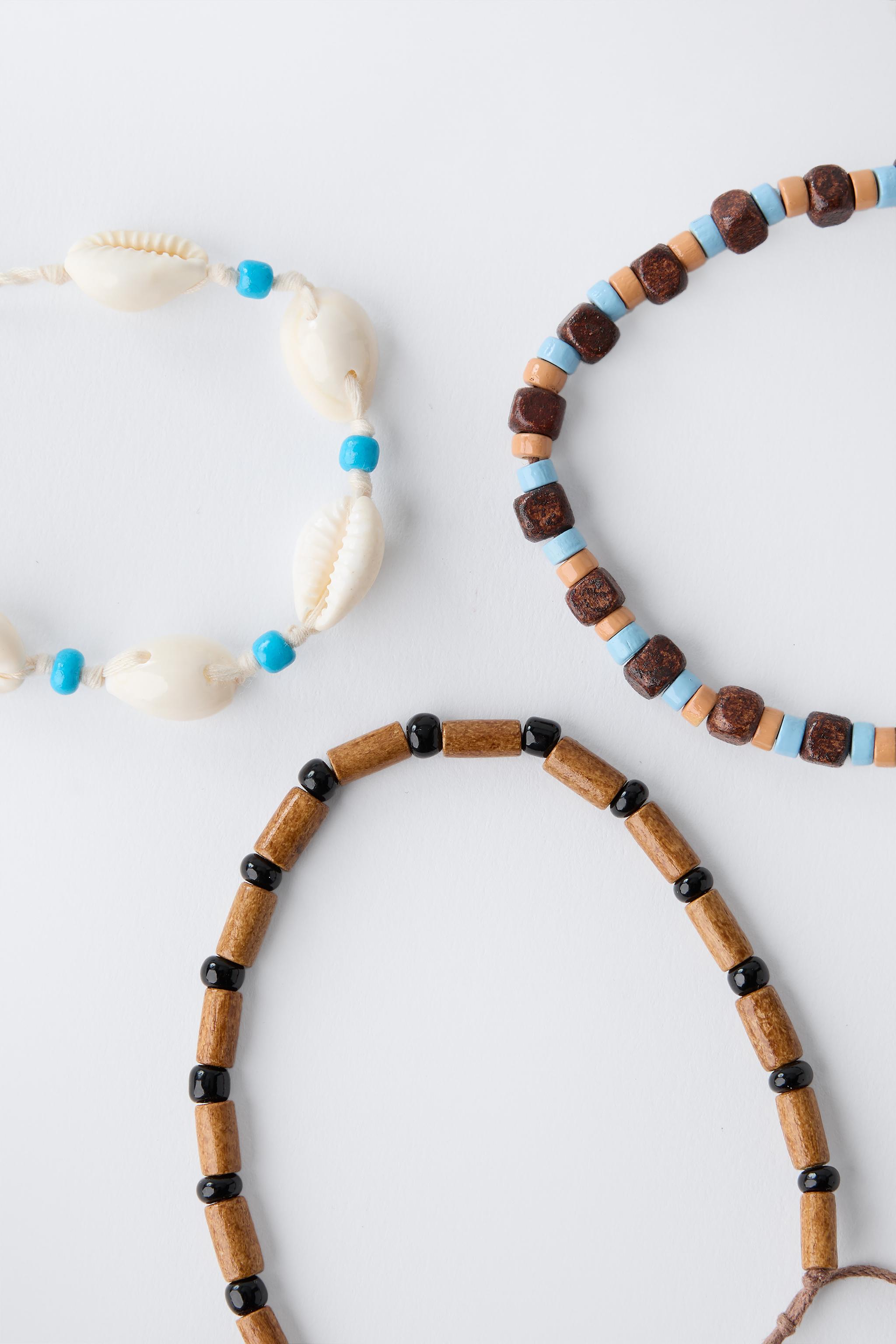 LOT DE TROIS BRACELETS FANTAISIE COQUILLAGES