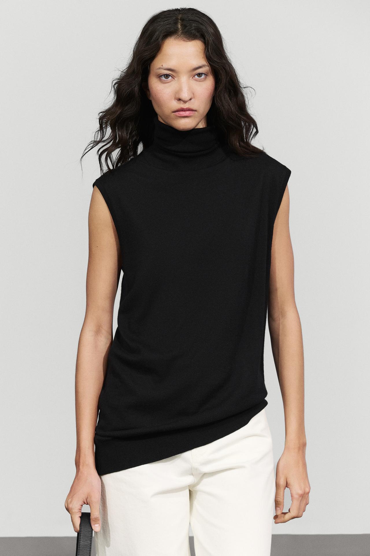 Asymmetric hem turtleneck top — Black