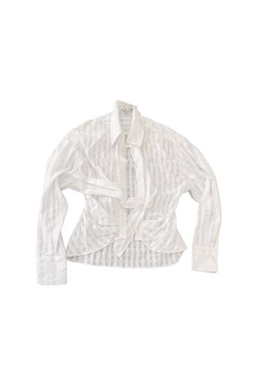 White vertical striped shirt, long sleeves, with a classic collar and a bow on the front, on a white background.