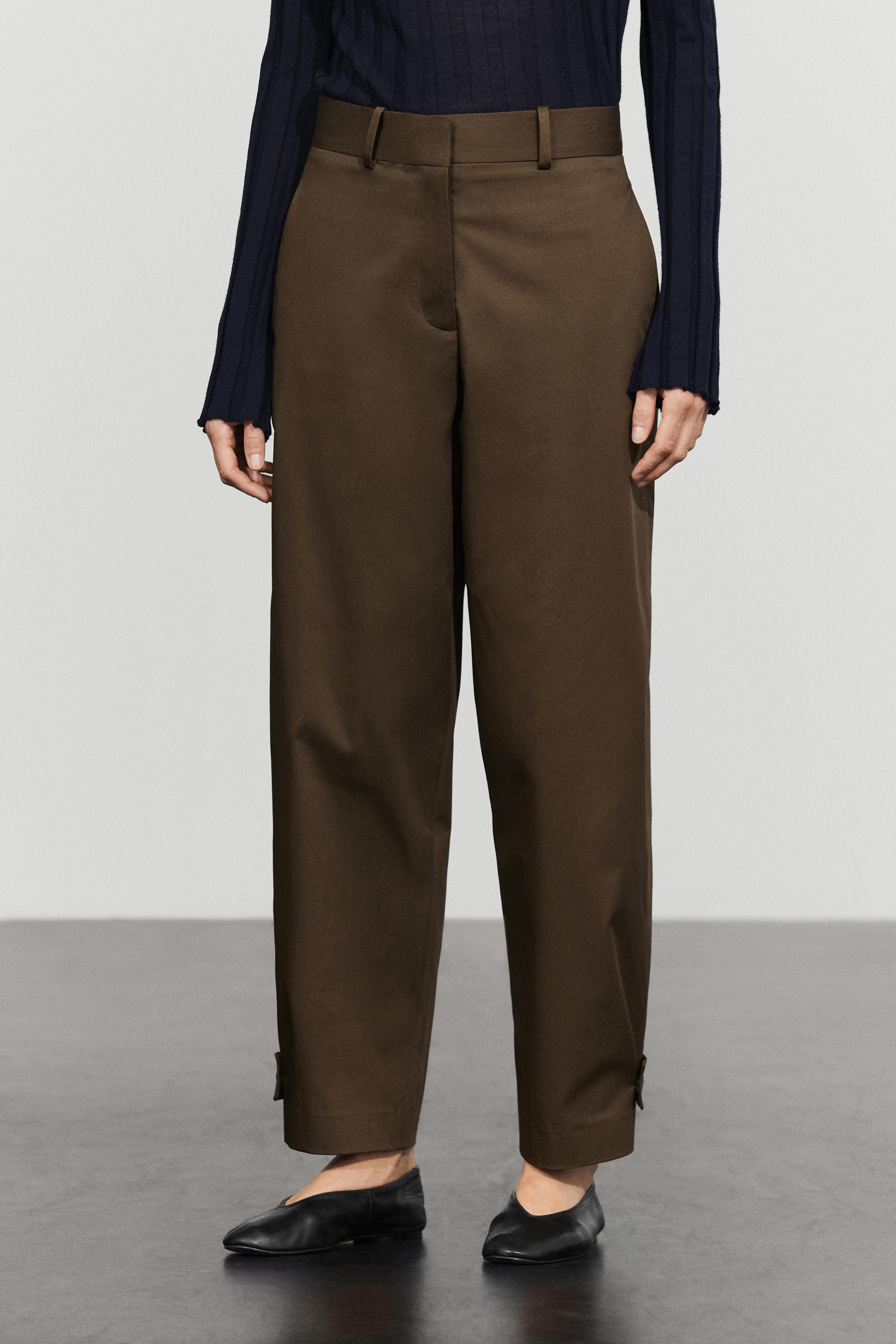 Pants with button-tab hem detail