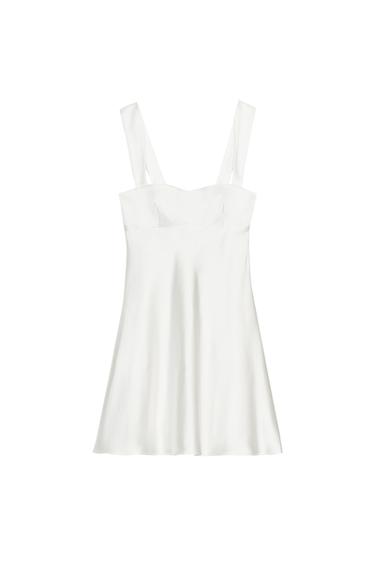 Front view of a white dress with wide straps and a square neckline.