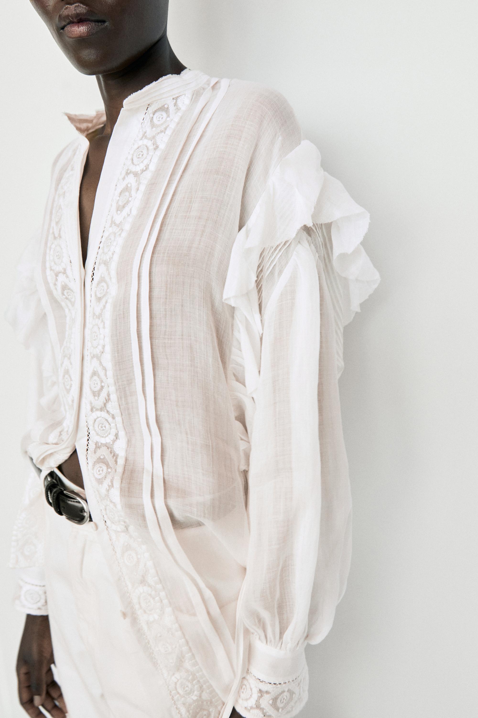 Stand collar blouse with embroidery and ruffles — White