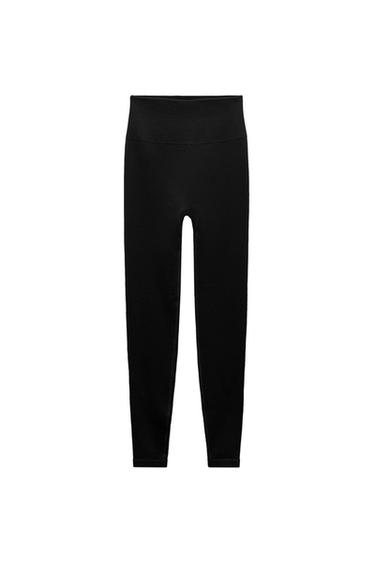 Front view of high-waisted black leggings