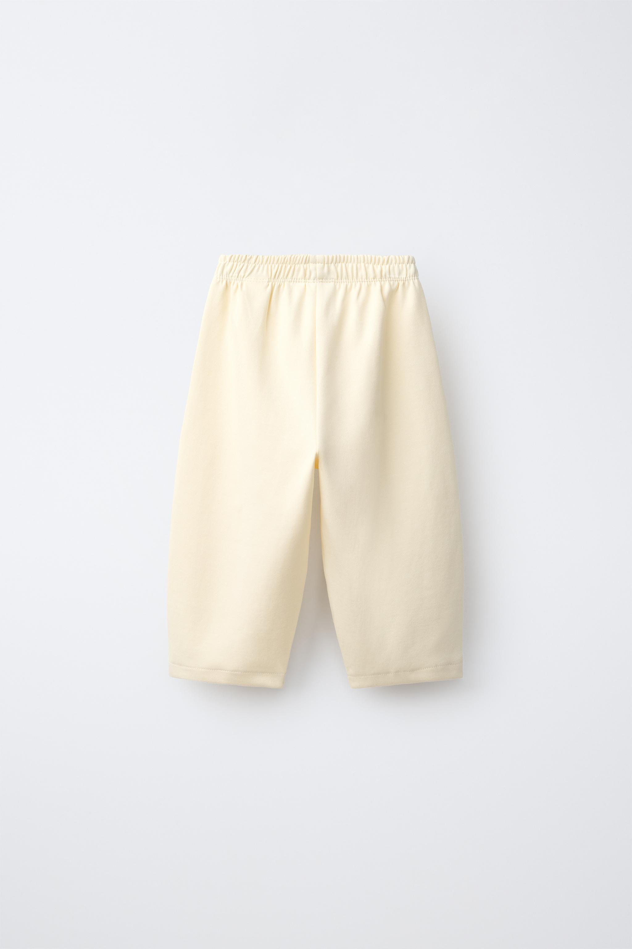 RUBBERIZED HEART INTERLOCK BARREL PANTS — Butter