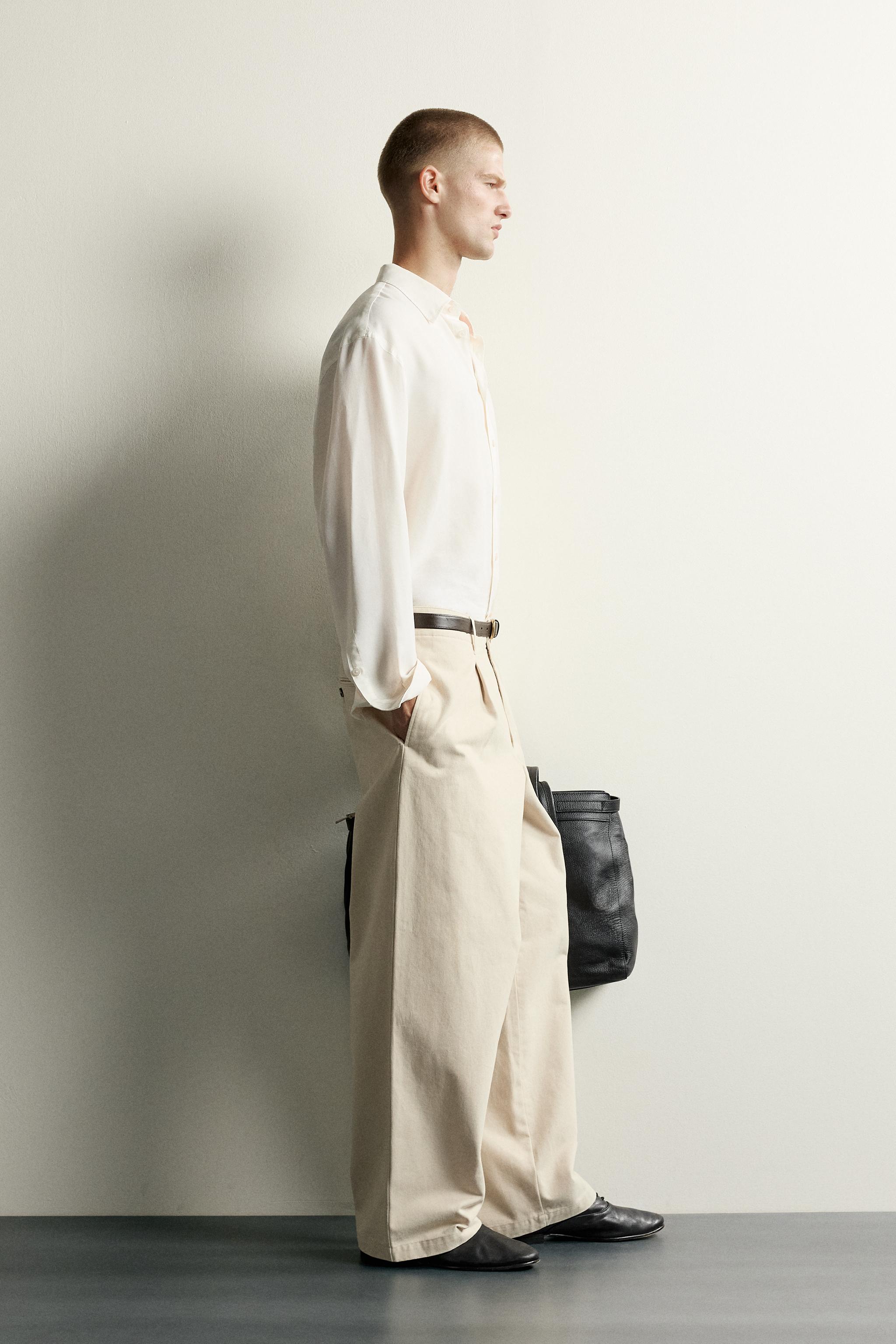 RELAXED FIT PLEATED PANTS