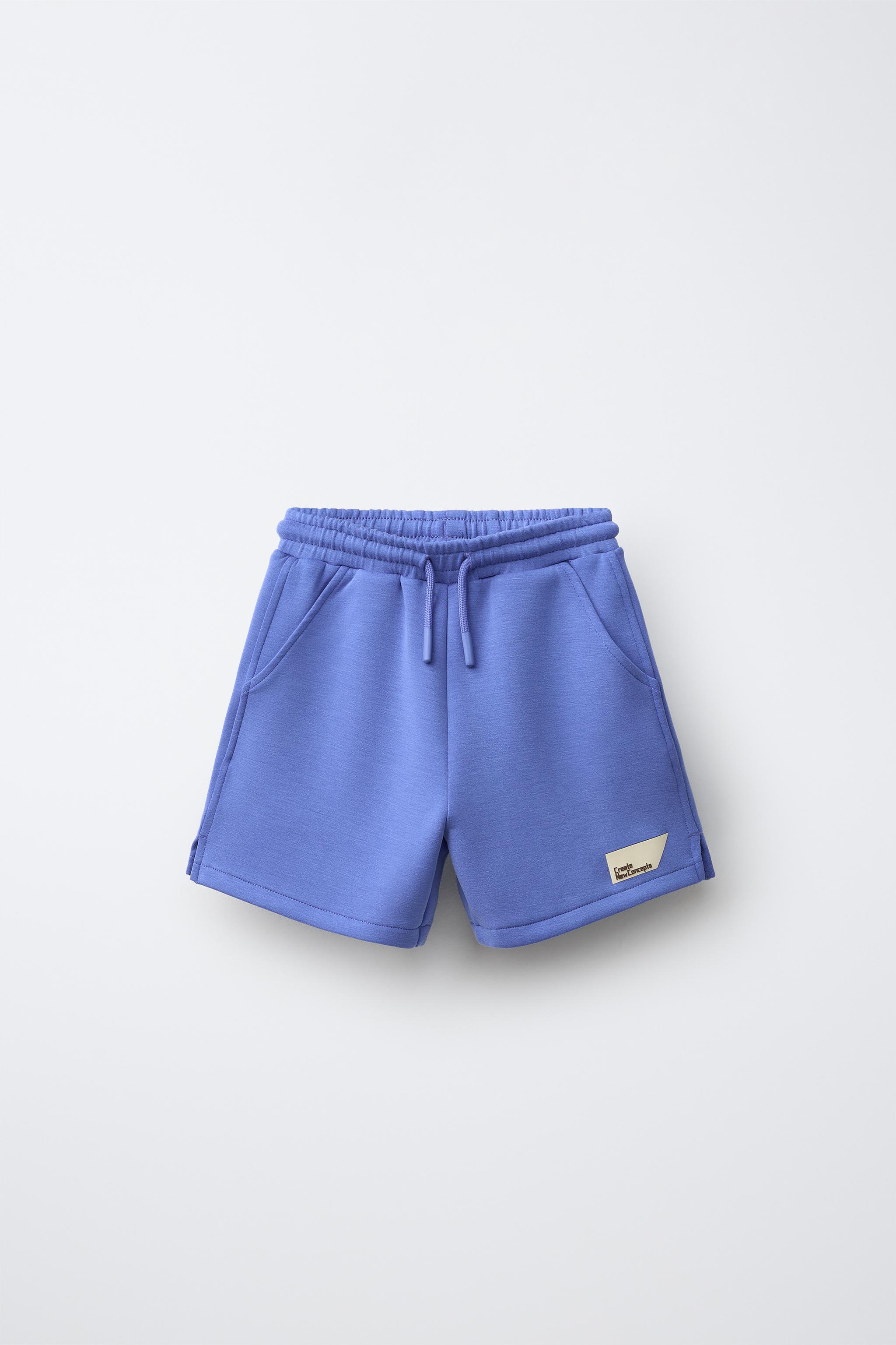 SHORT EN INTERLOCK À ÉTIQUETTE