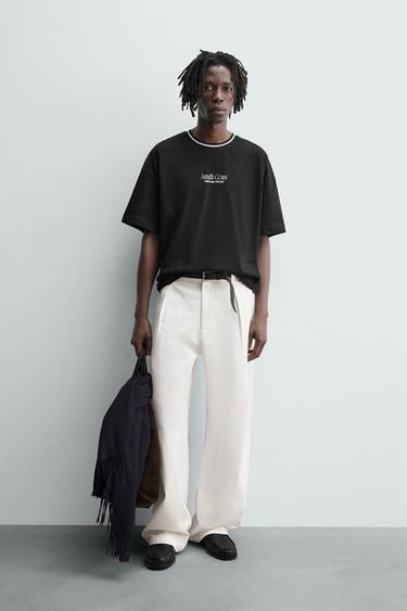 CAMISETA TEXTOS ESTAMPADOS RELIEVE - Negro de Zara - Imagen 0
