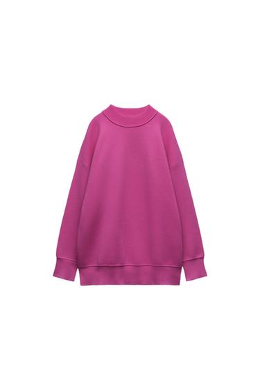 Front view of a pink sweatshirt with a round neck and long sleeves.