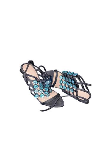 Black sandals with straps and blue stone embellishments on the vamp.
