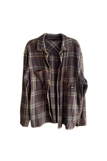 Brown and blue checked shirt with chest pockets and front buttons. Visible label with text "Zara".