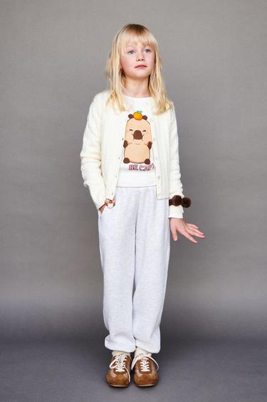 ΜΠΛΟΥΖΑ ΡΙΠ ΚΑΠΙΜΠΑΡΑ ΚΑΠΥΦΑΝ © - Λευκό του Zara