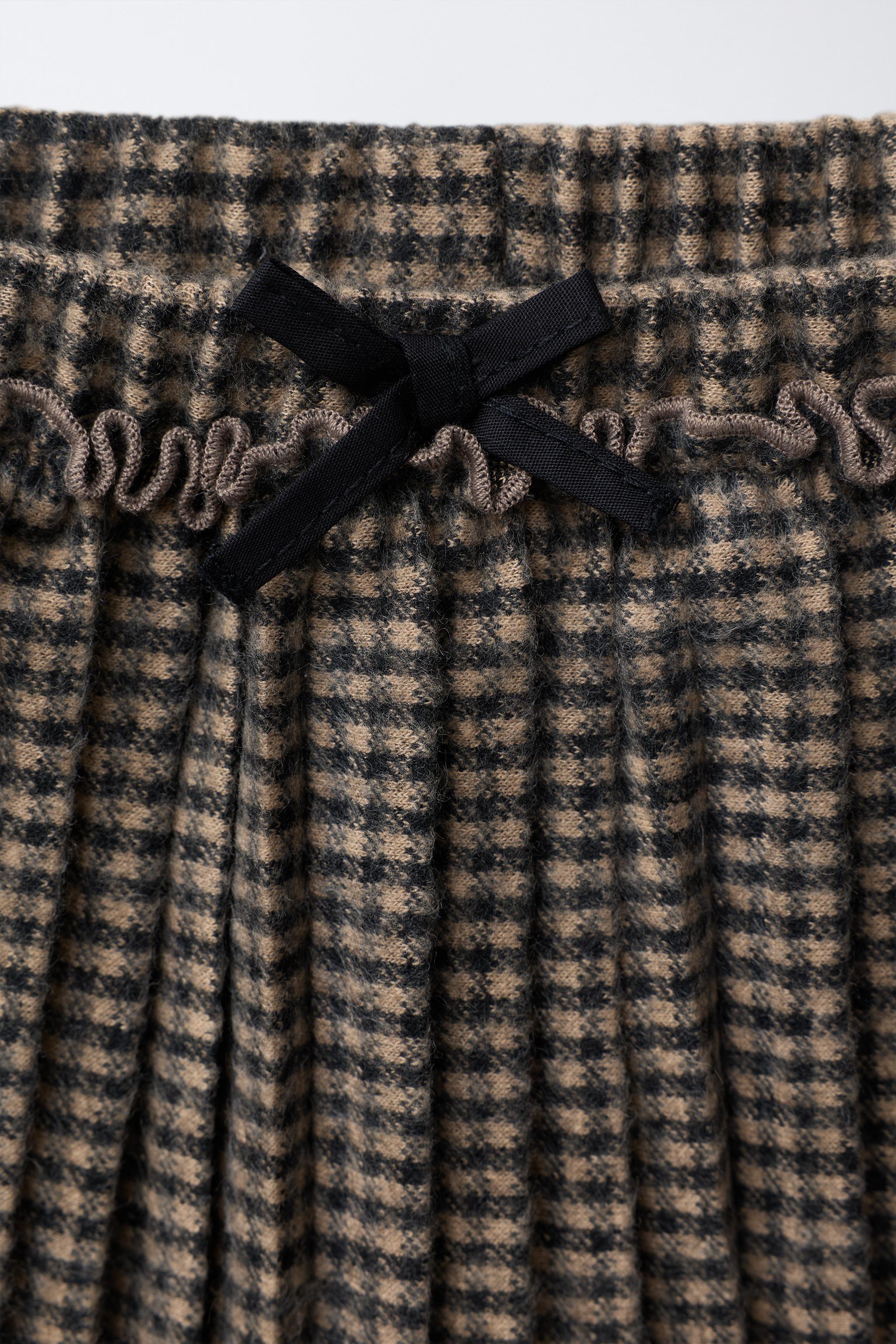 JUPE-SHORT PLISSÉE À CARREAUX