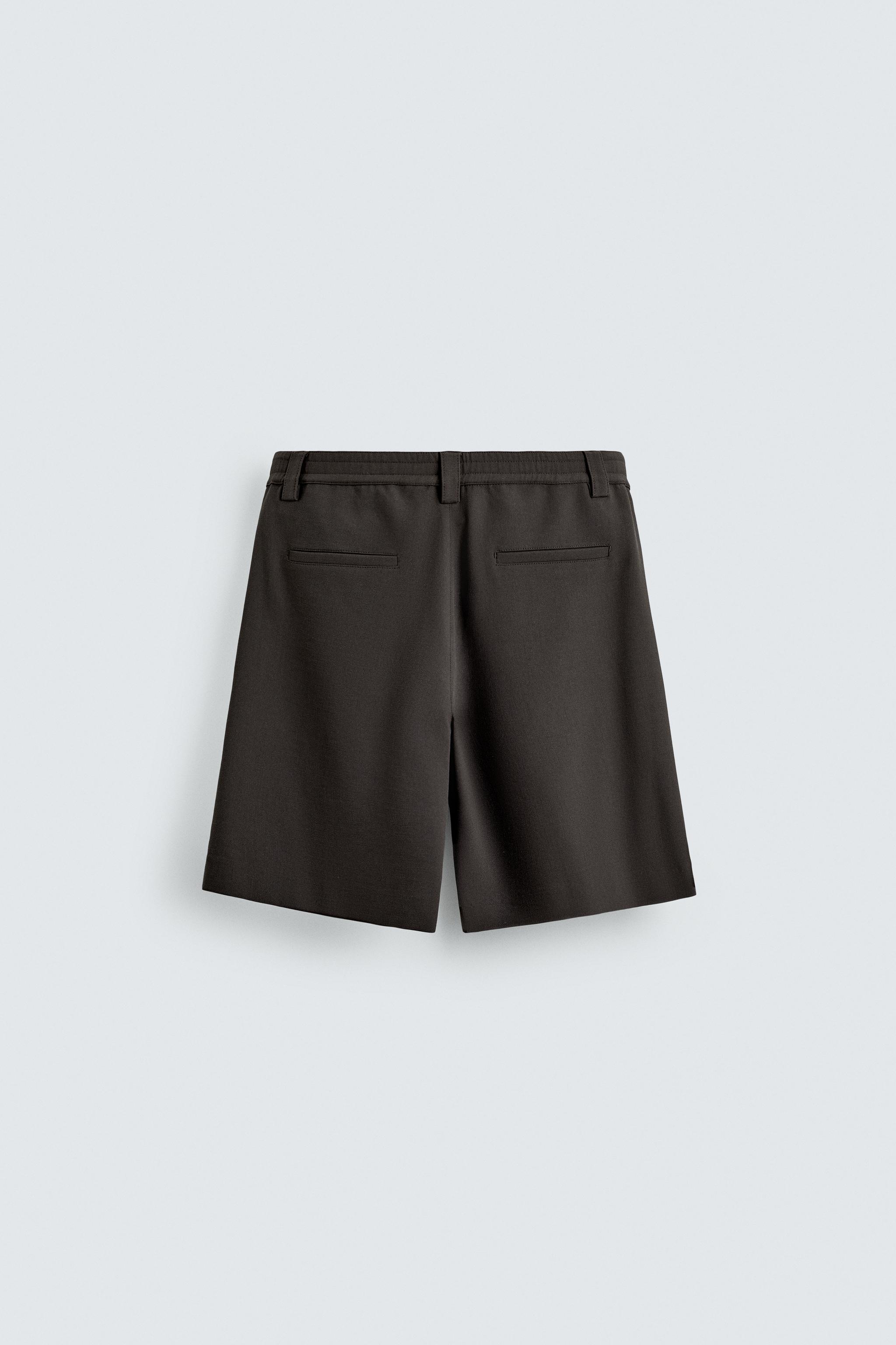 BERMUDA RELAXED FIT PLIS LATÉRAUX