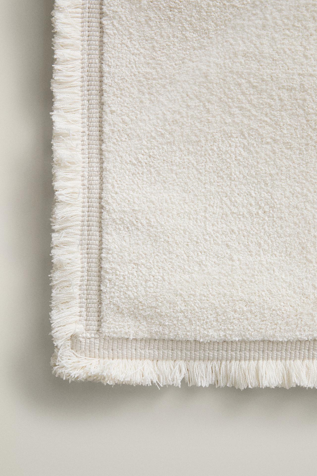 FRINGED AREA RUG — Oyster-white