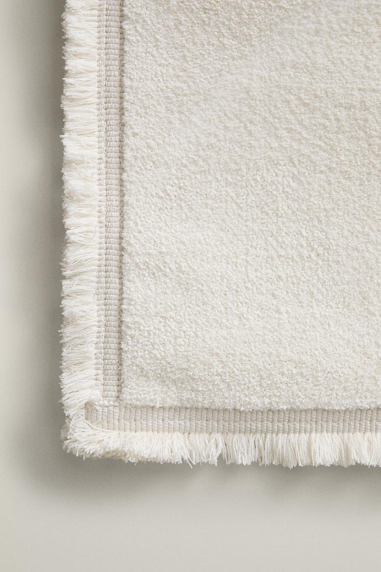 FRINGED AREA RUG — Oyster-white
