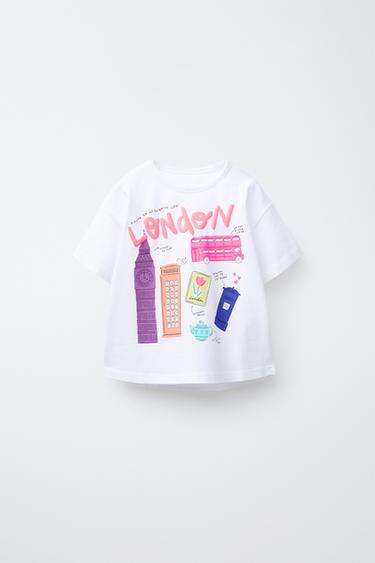 Zaras T-SHIRT MED STADSTRYCK - Vit