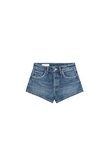 Front view of blue denim shorts with front pockets and button fastening.