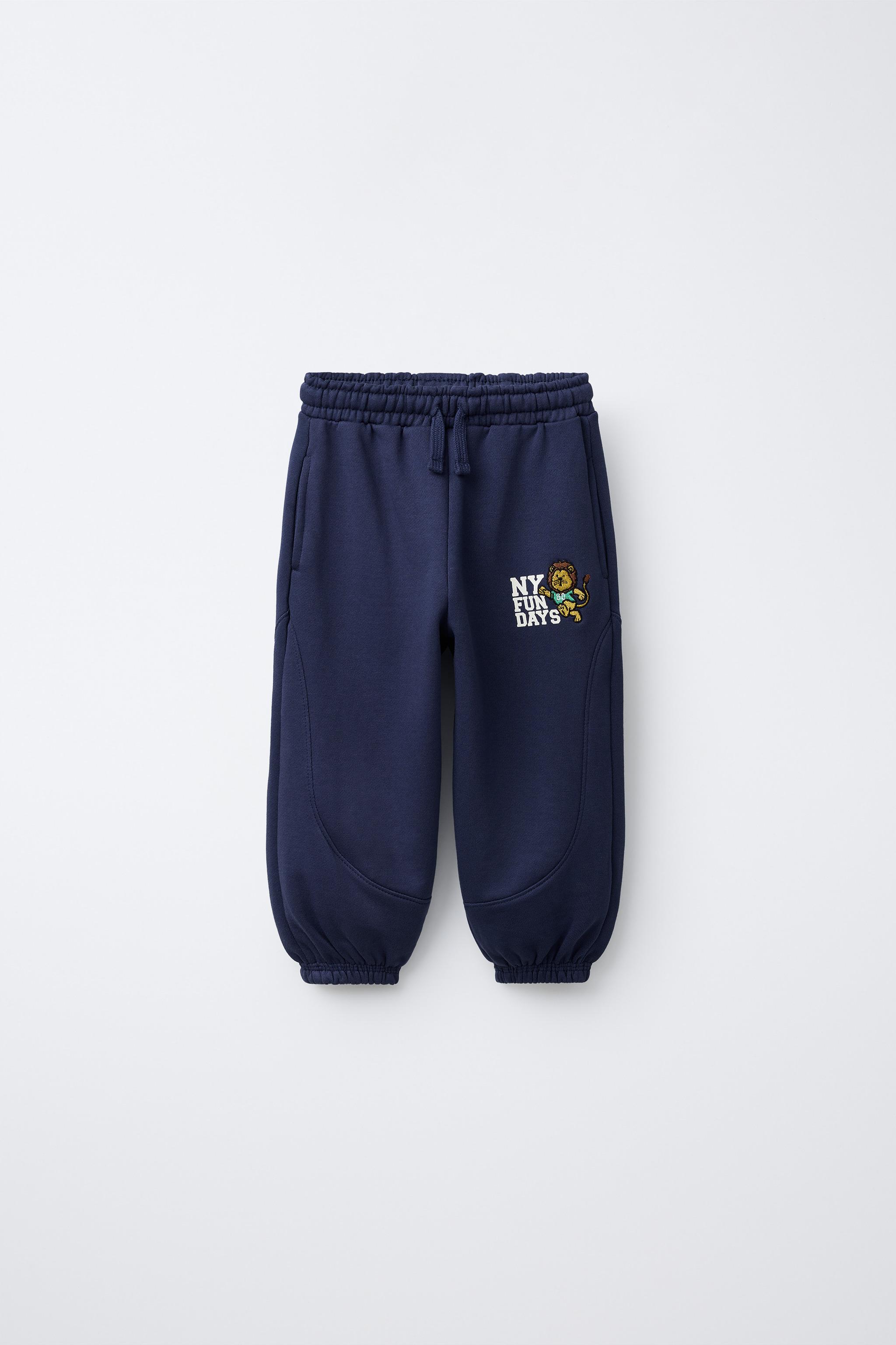 EMBROIDERED LION JOGGERS