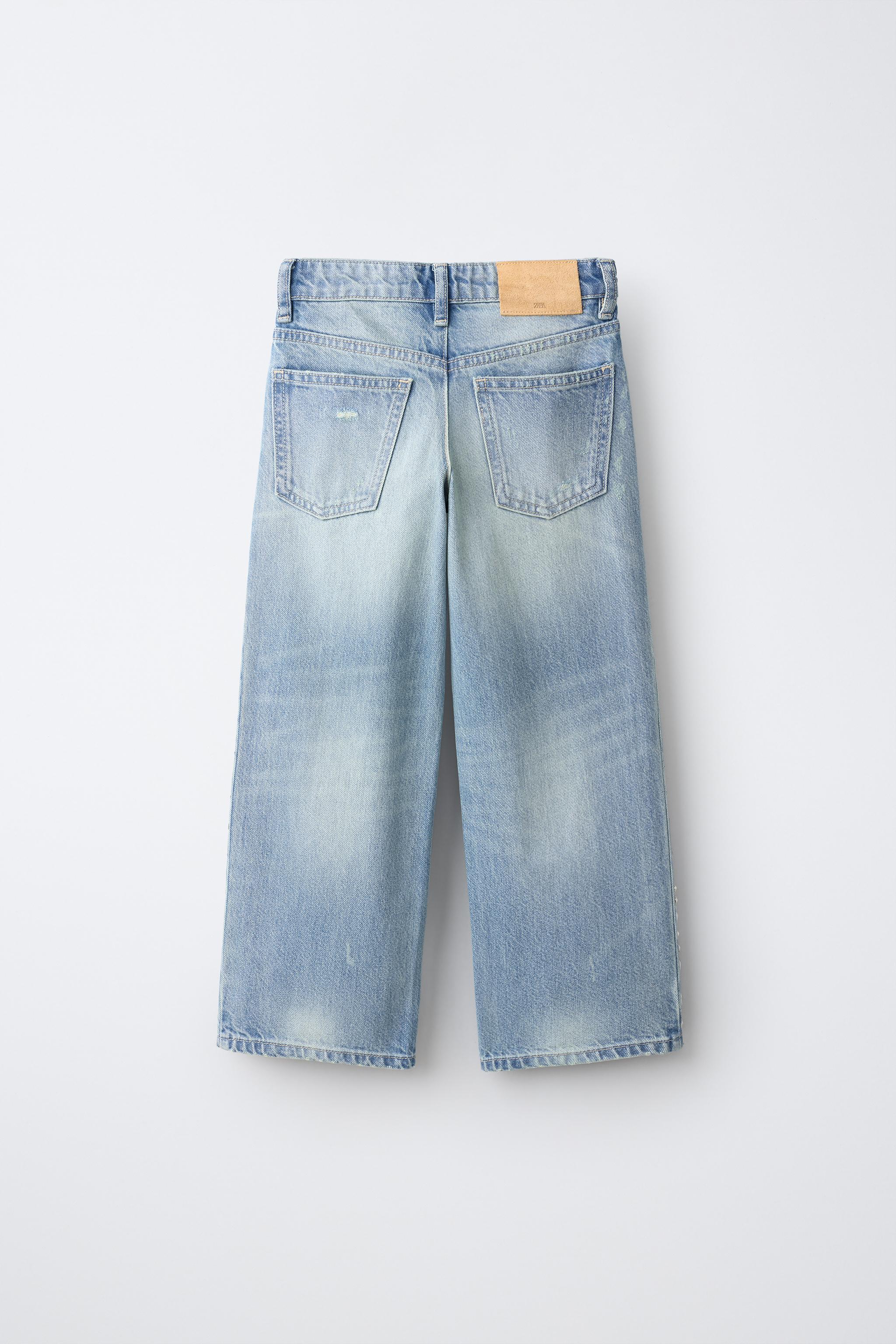 RIPPED STUDDED FLARE JEANS