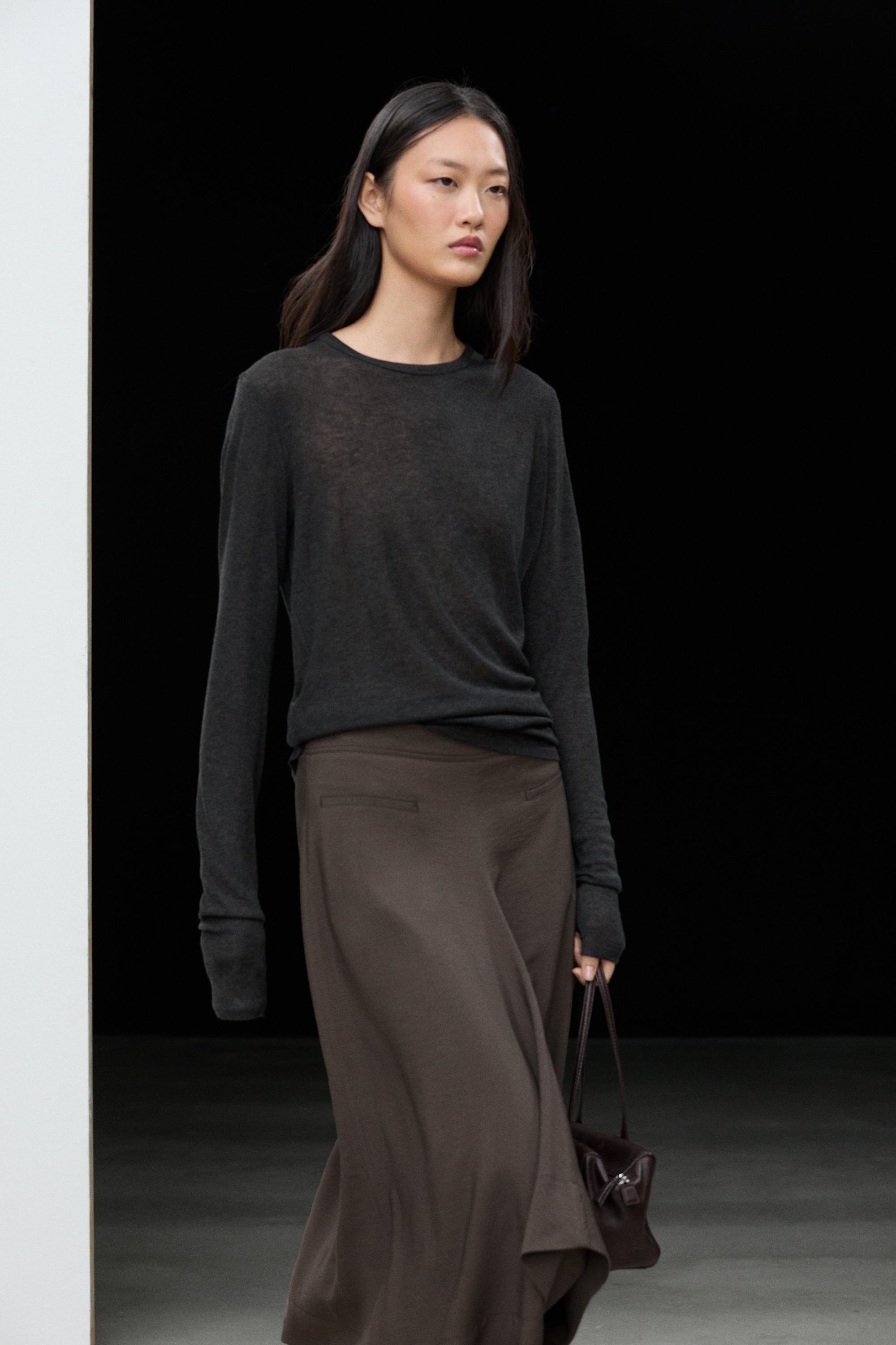 Flowing midi skirt with pleated detail