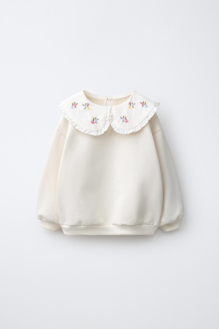 Sudadera cuello combinado flores bordadas