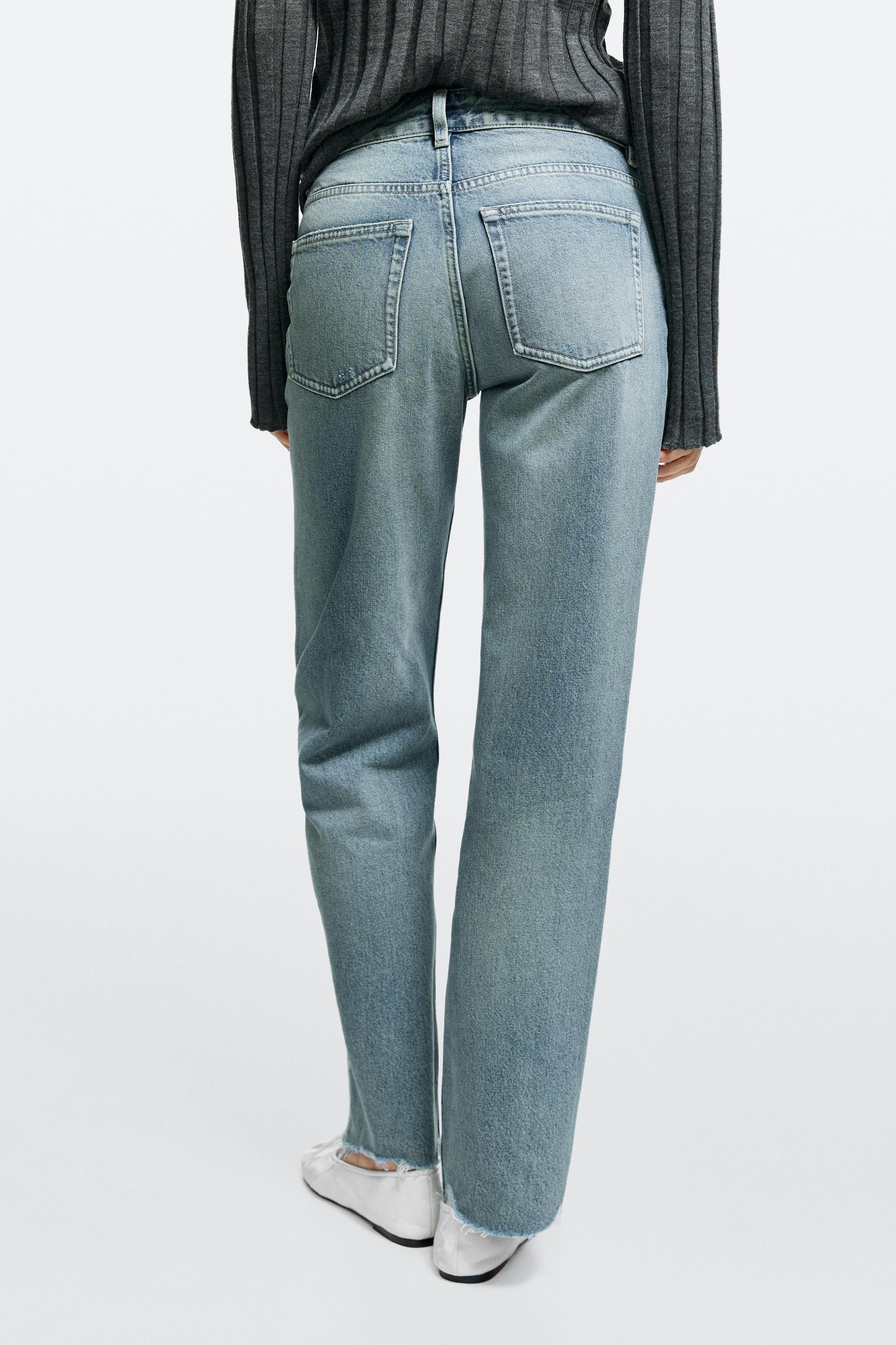 Stovepipe fit mid-rise jeans with frayed hems