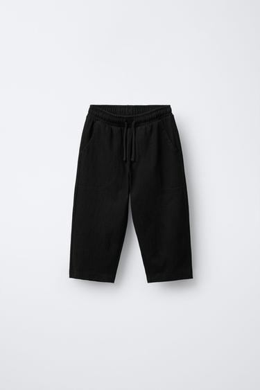 TEXTURED TROUSERS WITH LABEL - Black by Zara