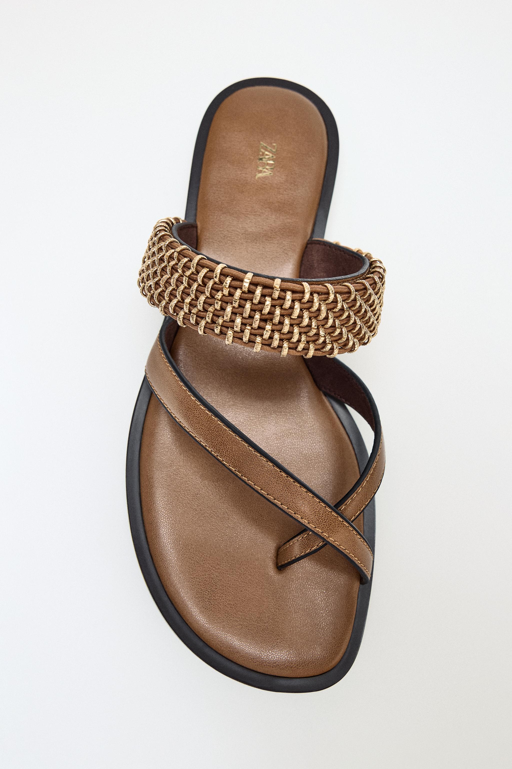 FLAT SANDALS WITH METAL DETAILS