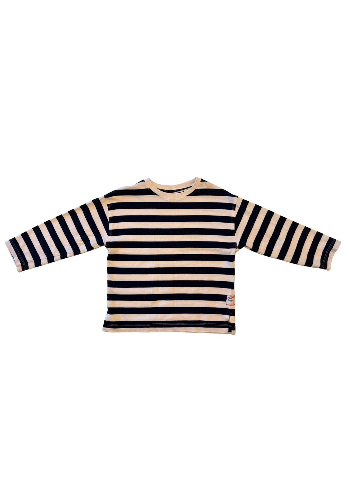 Long-sleeved T-shirt with black and white horizontal stripes on a white background. Small label on the bottom right side.