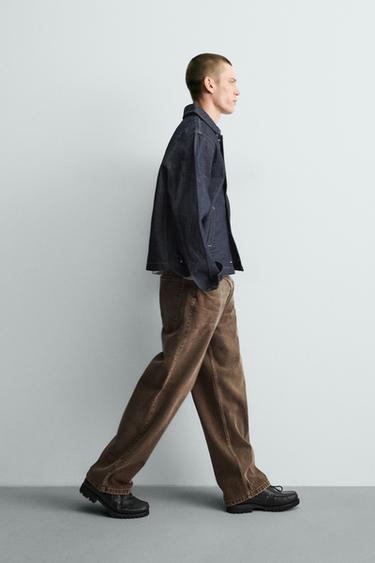 JEANS RELAXED FIT MET GEWAXT EFFECT - Bruin van Zara