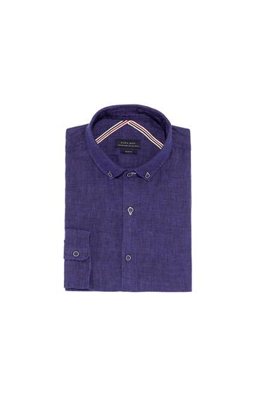 Navy blue long-sleeved shirt, rolled up, with a classic collar and buttons. Visible label: "ZARA MAN SLIM FIT".