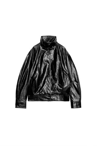 Front view of a black bomber jacket with a funnel neck, long sleeves, front pockets and a zip-up front fastening.