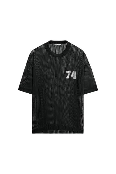 Black mesh t-shirt with the number 74 in white on the chest. Short-sleeve and crew-neck design.