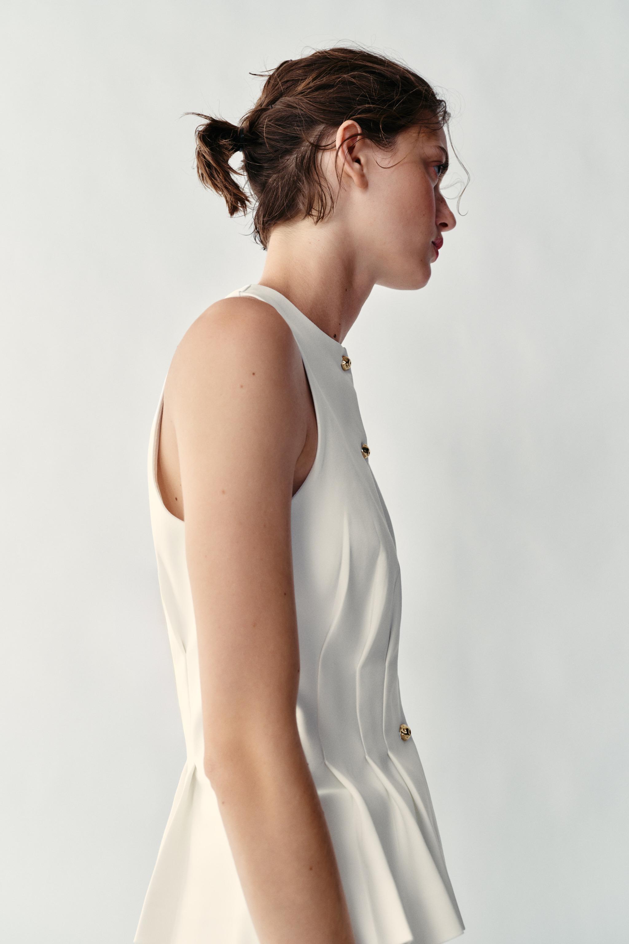 GILET À PINCES