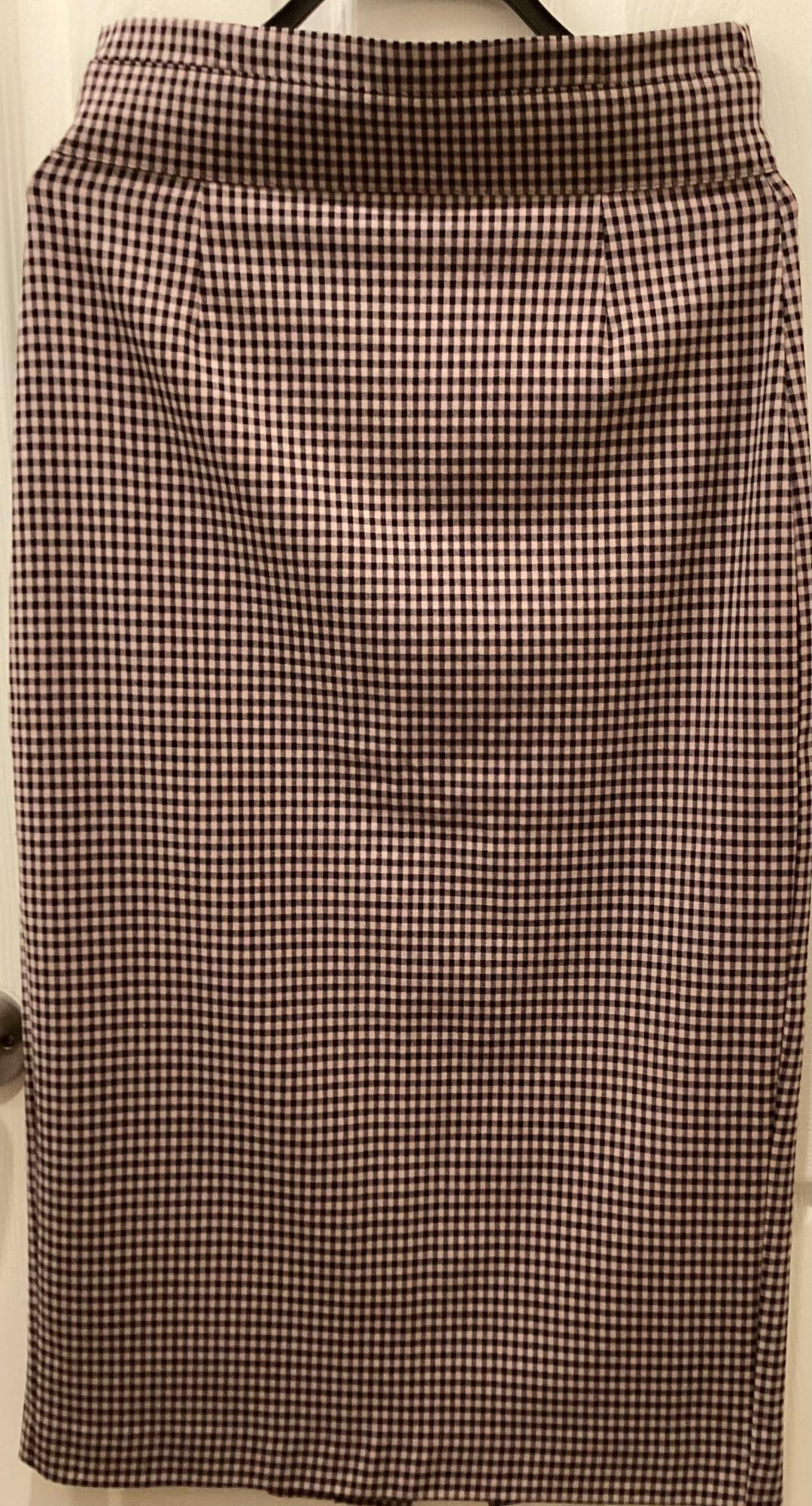 Front view of a brown and white plaid skirt.