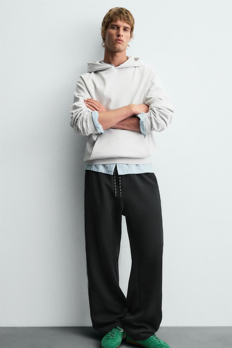 WIDE FIT JOGGER PANTS WITH SIDE STRIPES
