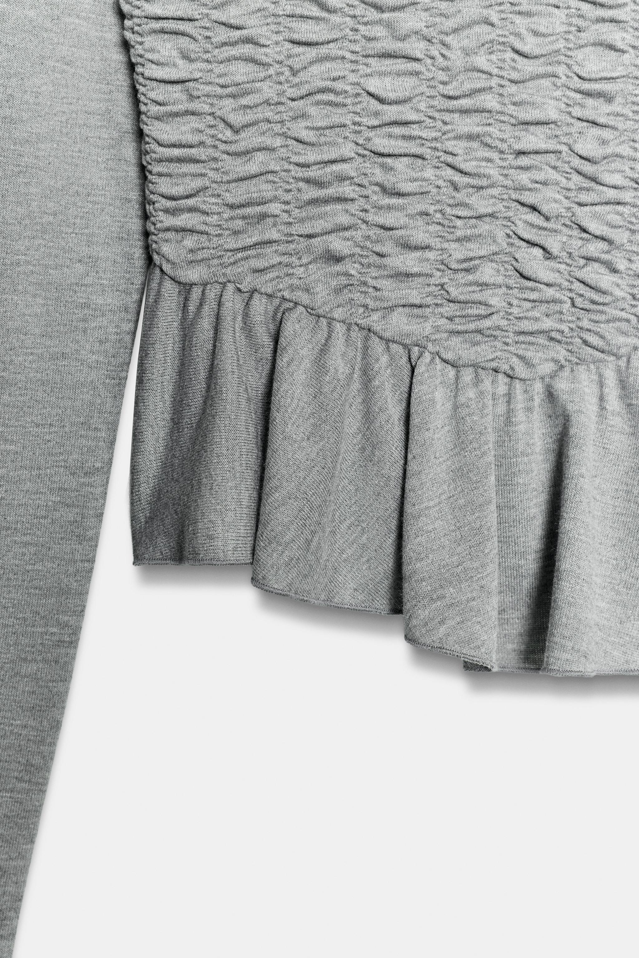 SMOCKED PEPLUM TOP