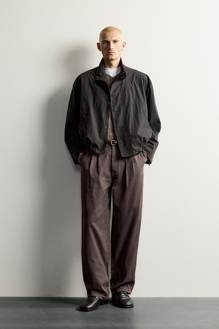 WASHED RELAXED FIT PLEATED TROUSERS