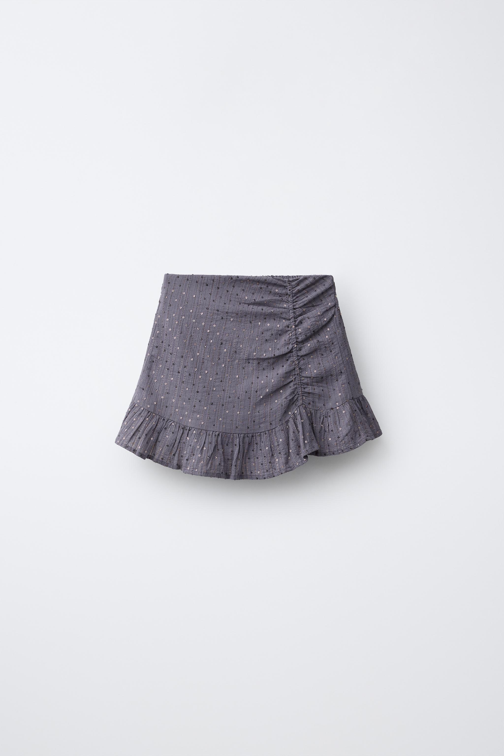 JUPE DRAPÉE À PAILLETTES