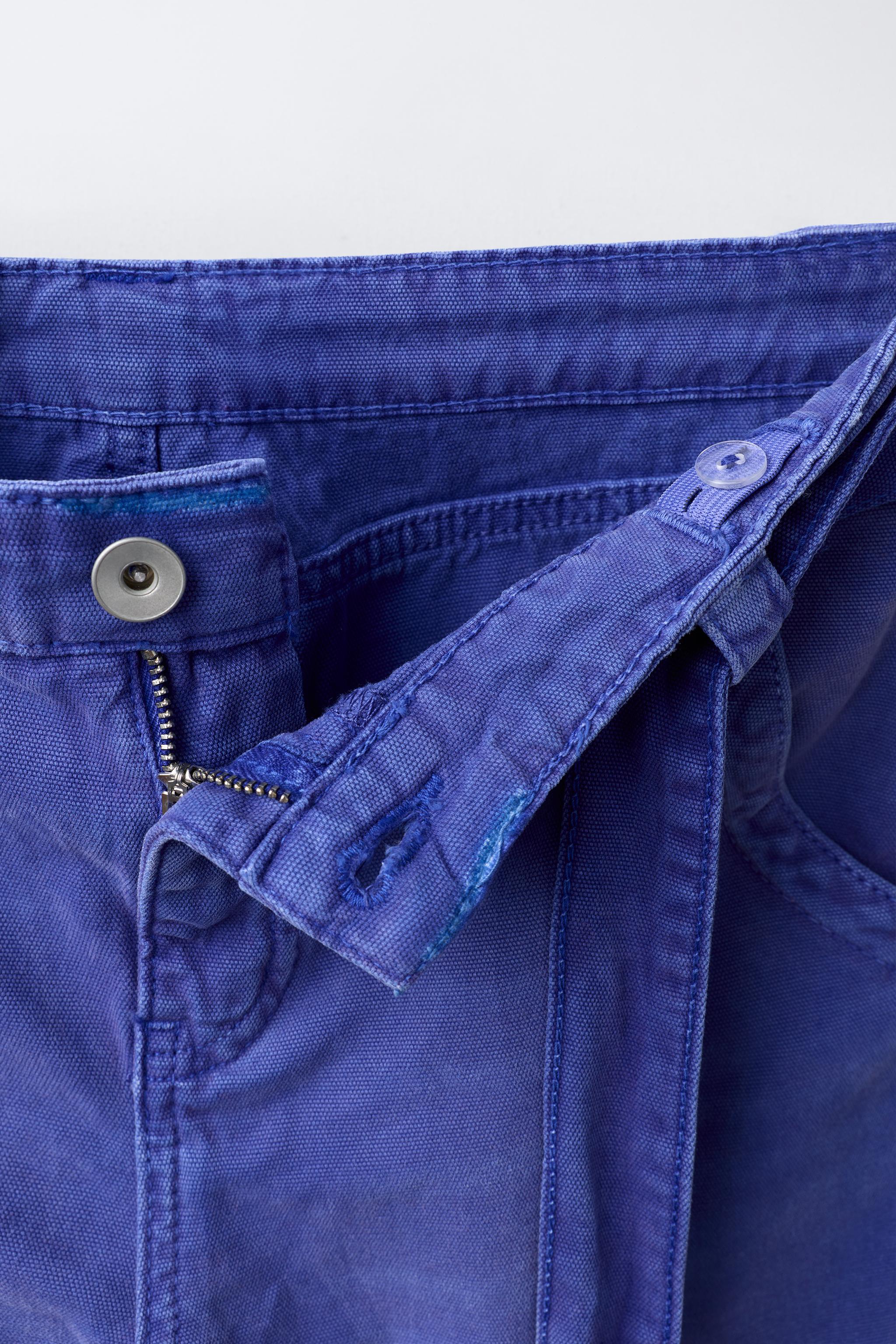 PANTALON EFFET DÉLAVÉ AVEC CEINTURE
