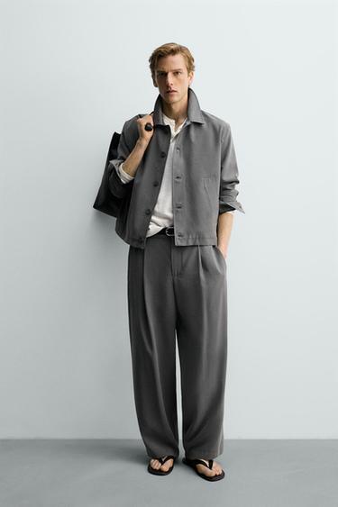 PANTALONS FLUIDS AMB PLECS - Gris talp de Zara