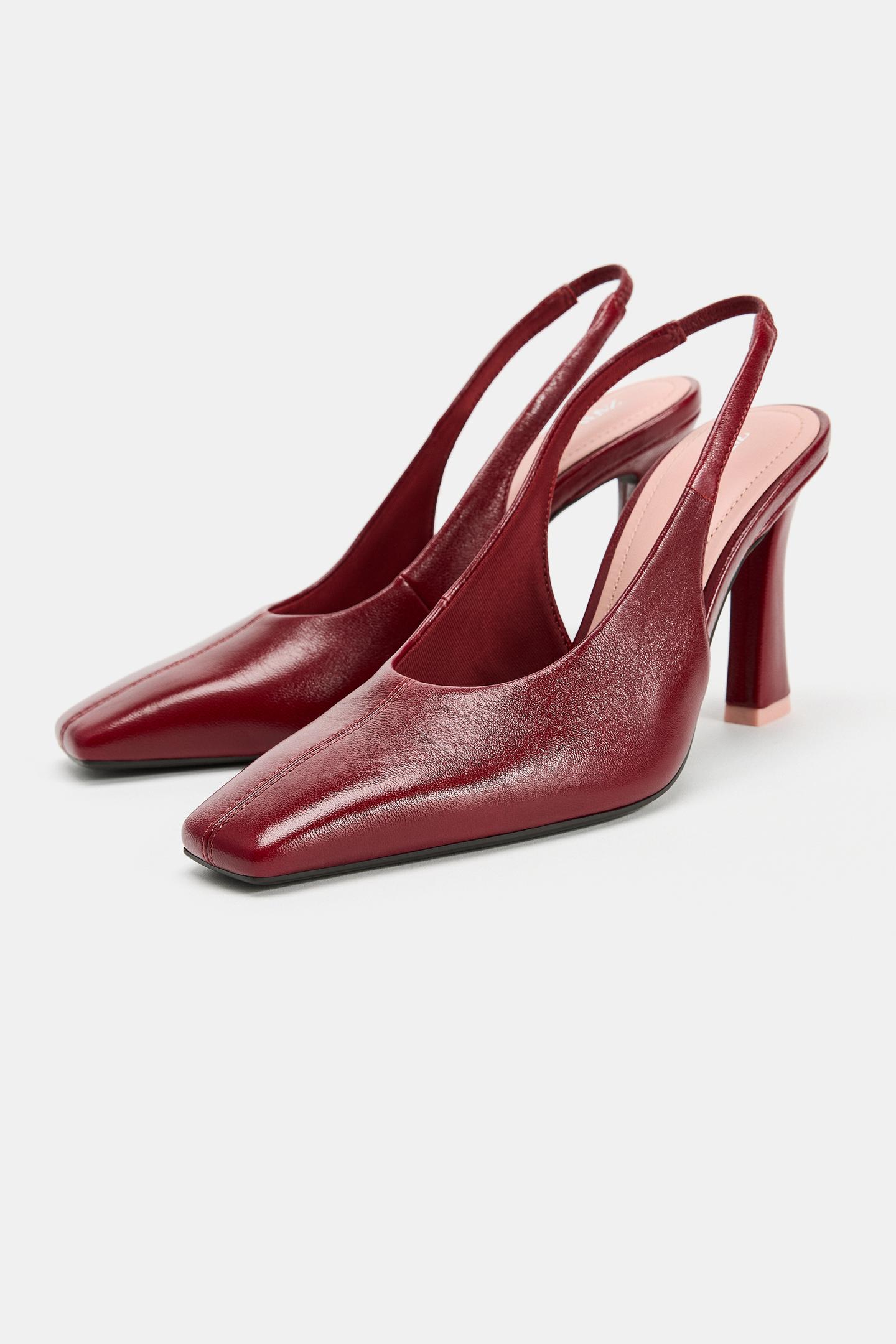Front view of burgundy red heels, slingback design, square toe, center seam, and high flared heel.